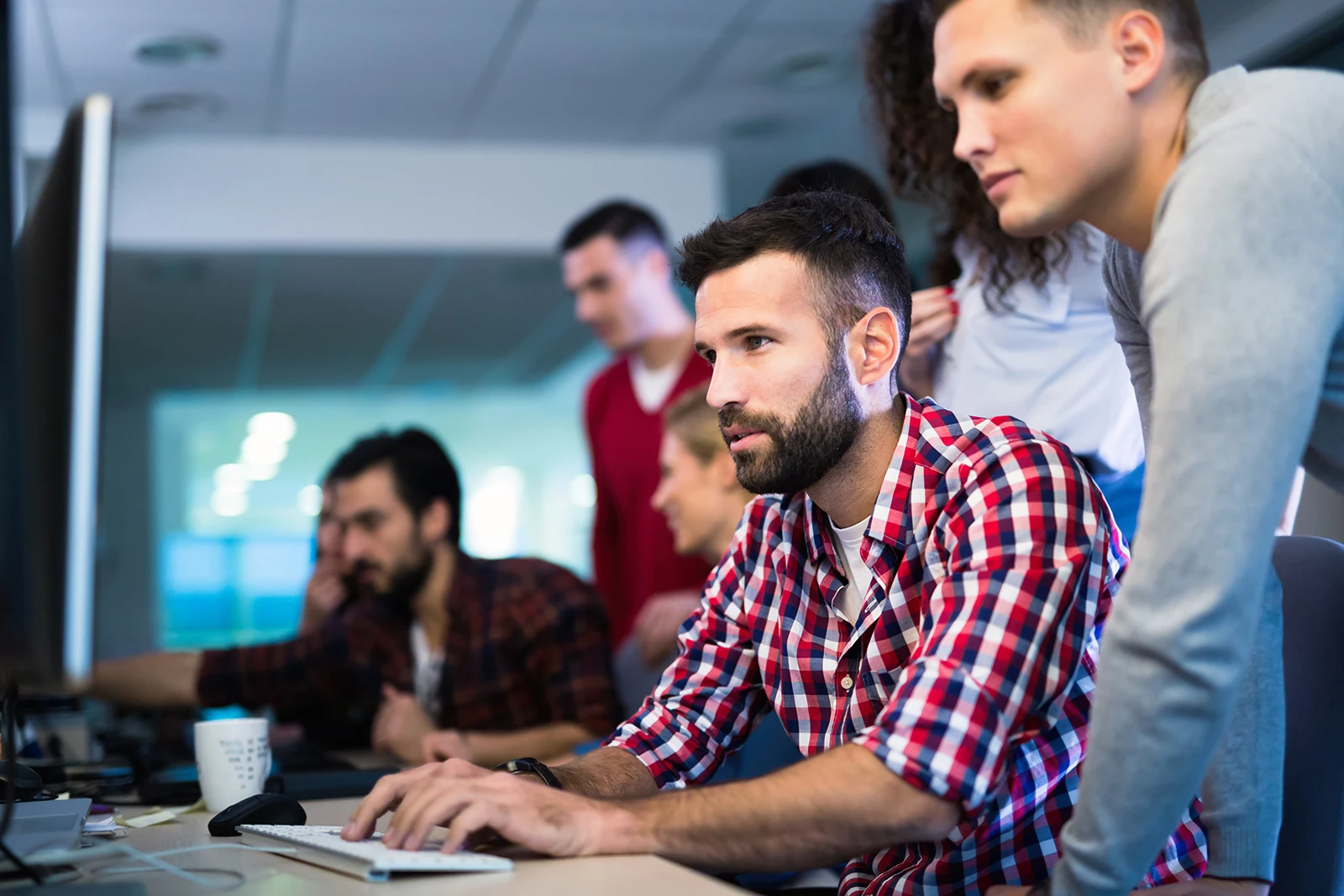 Dedicated software development team working together on a digital product